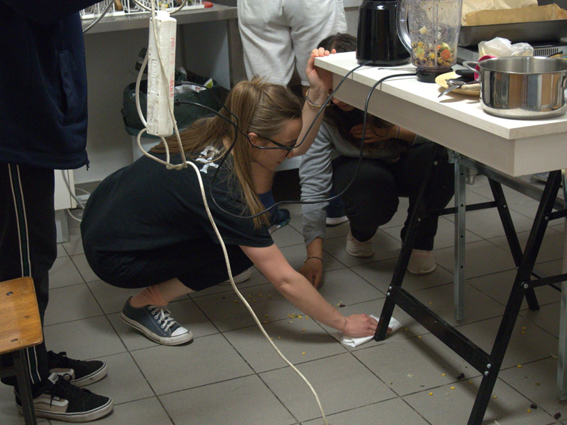 Picking what was suppose to be a burger from the floor