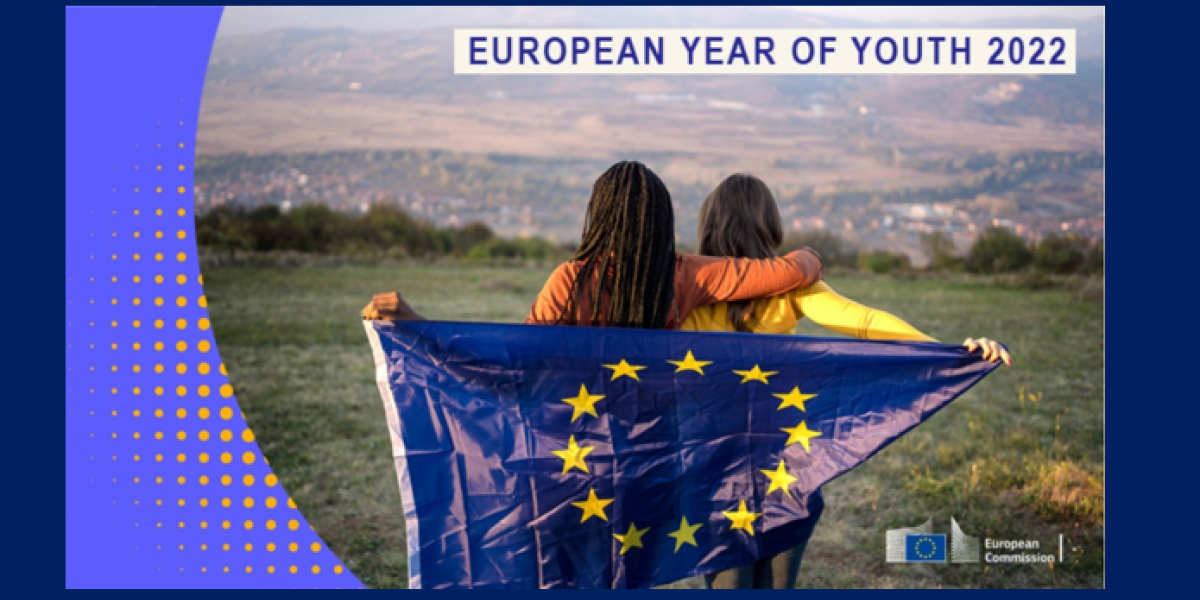 Two girls holding the European flag for the European Year of Youth 2022