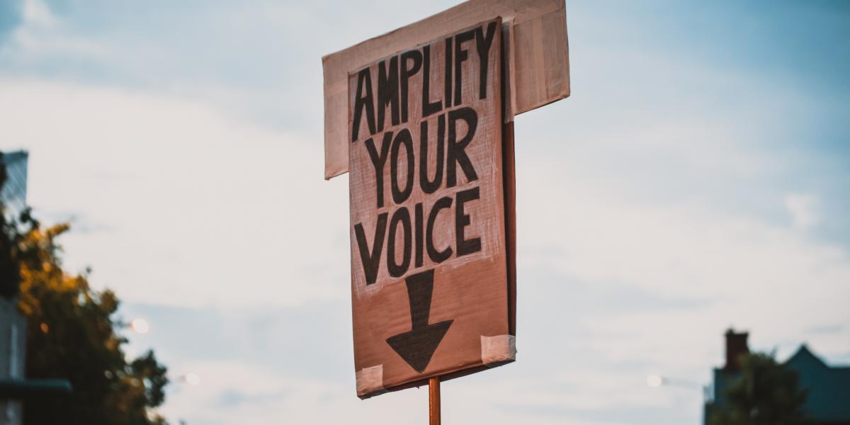 A demo card mentioning the words "Amplify your voice"