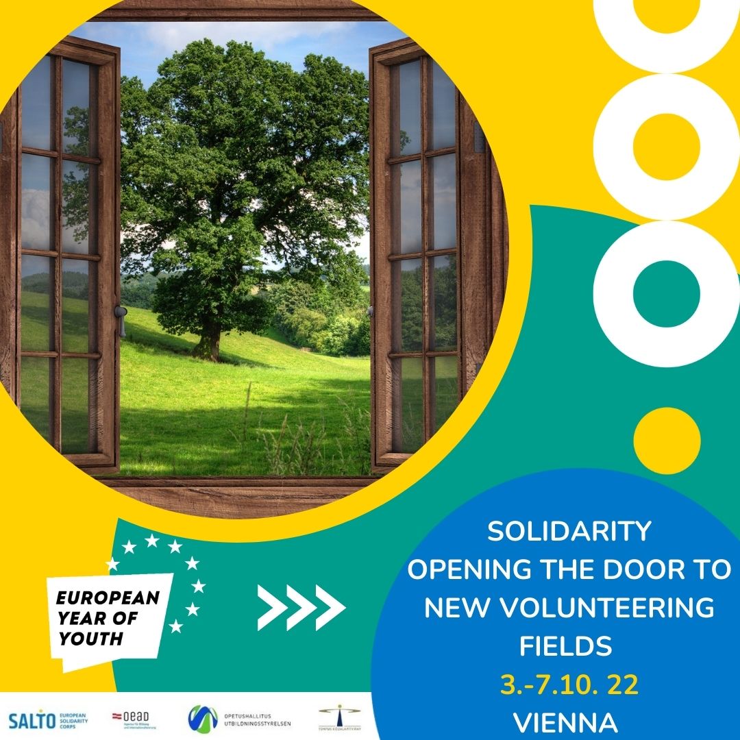 The picture shows an open door, outside you can see a green tree