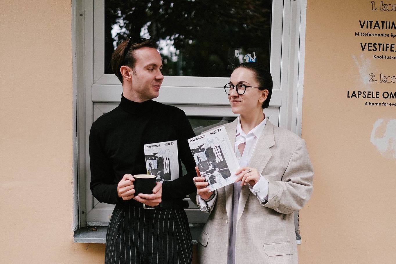 Two young people holing Narvamus magazine 