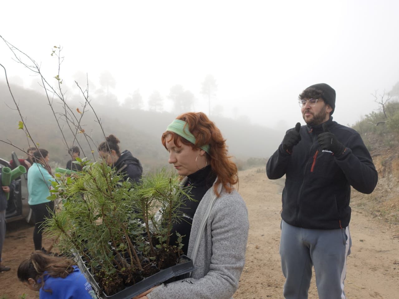 Laura-Elise and project participants replanting trees, 2024