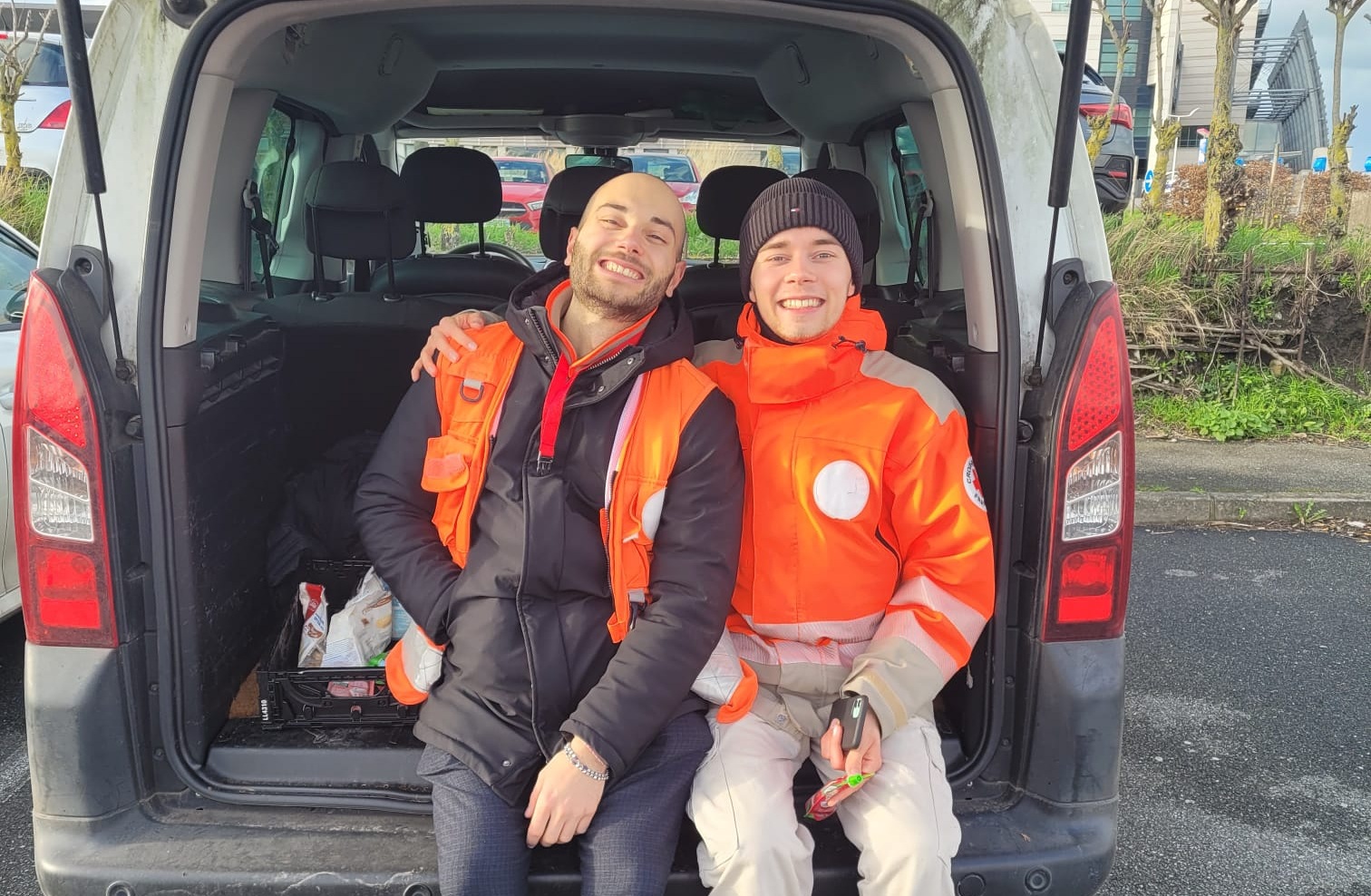 Kennert and his friend in a Red Cross vehicule