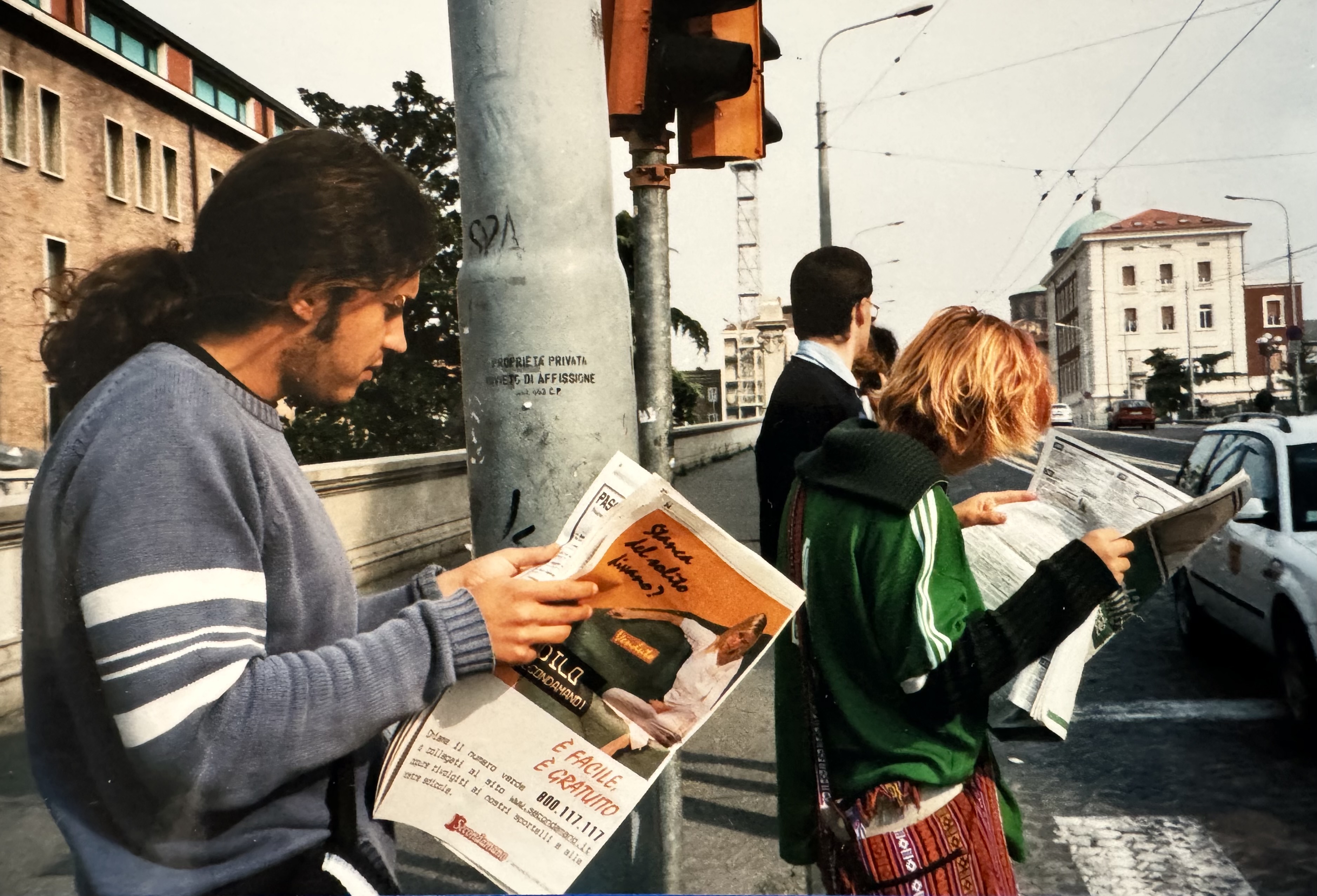 Volunteers reading a local paper