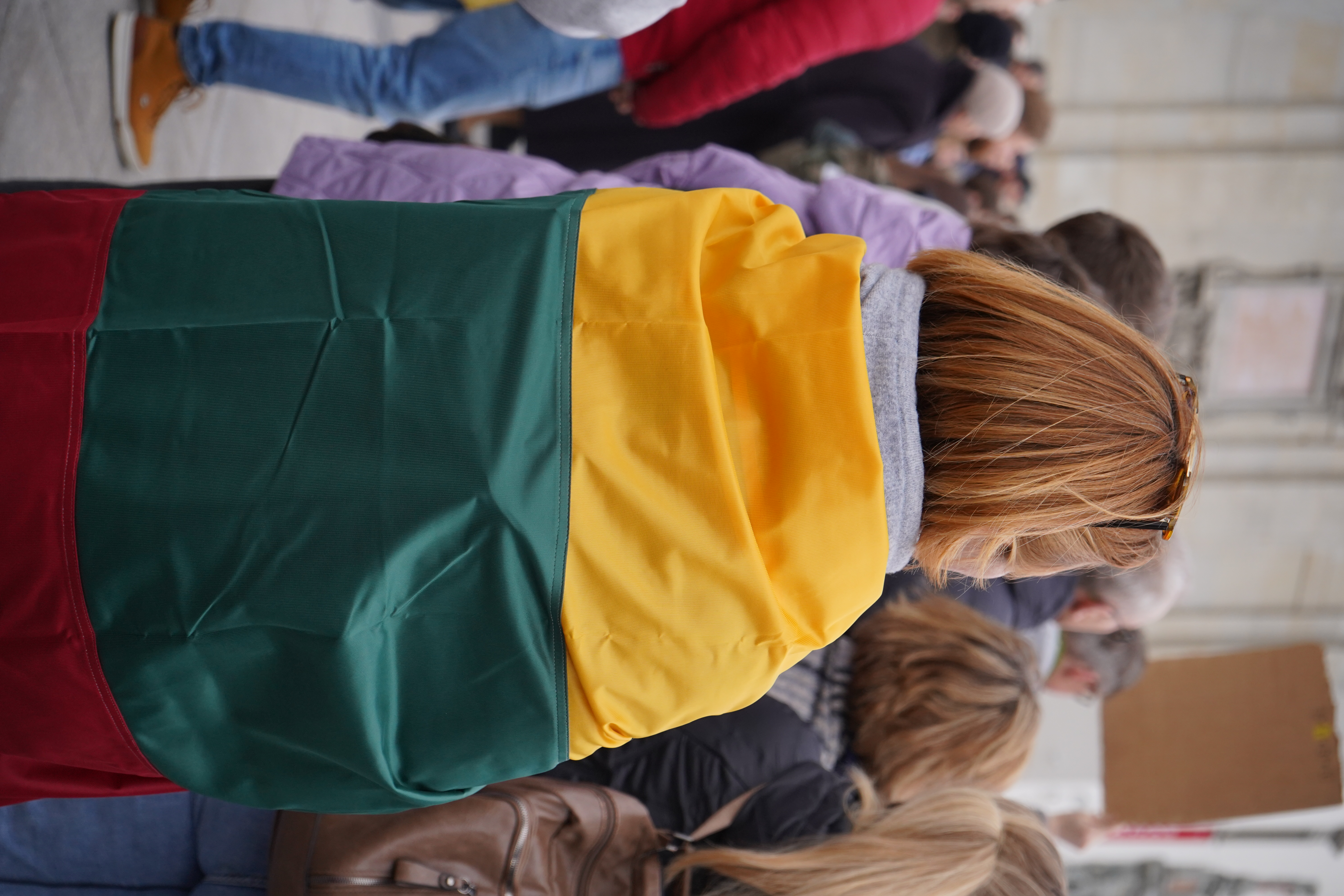 A female wearing the Lithuanian flag
