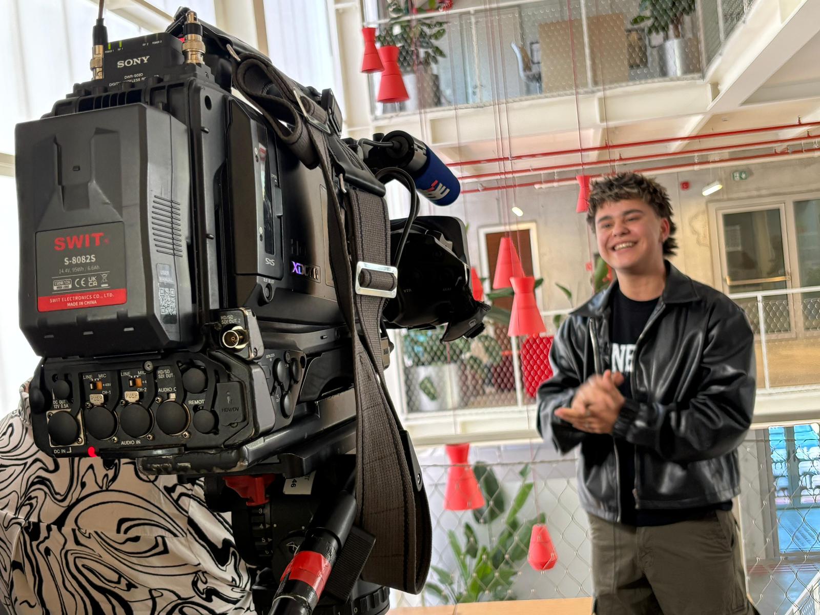 A young person infront of a camera