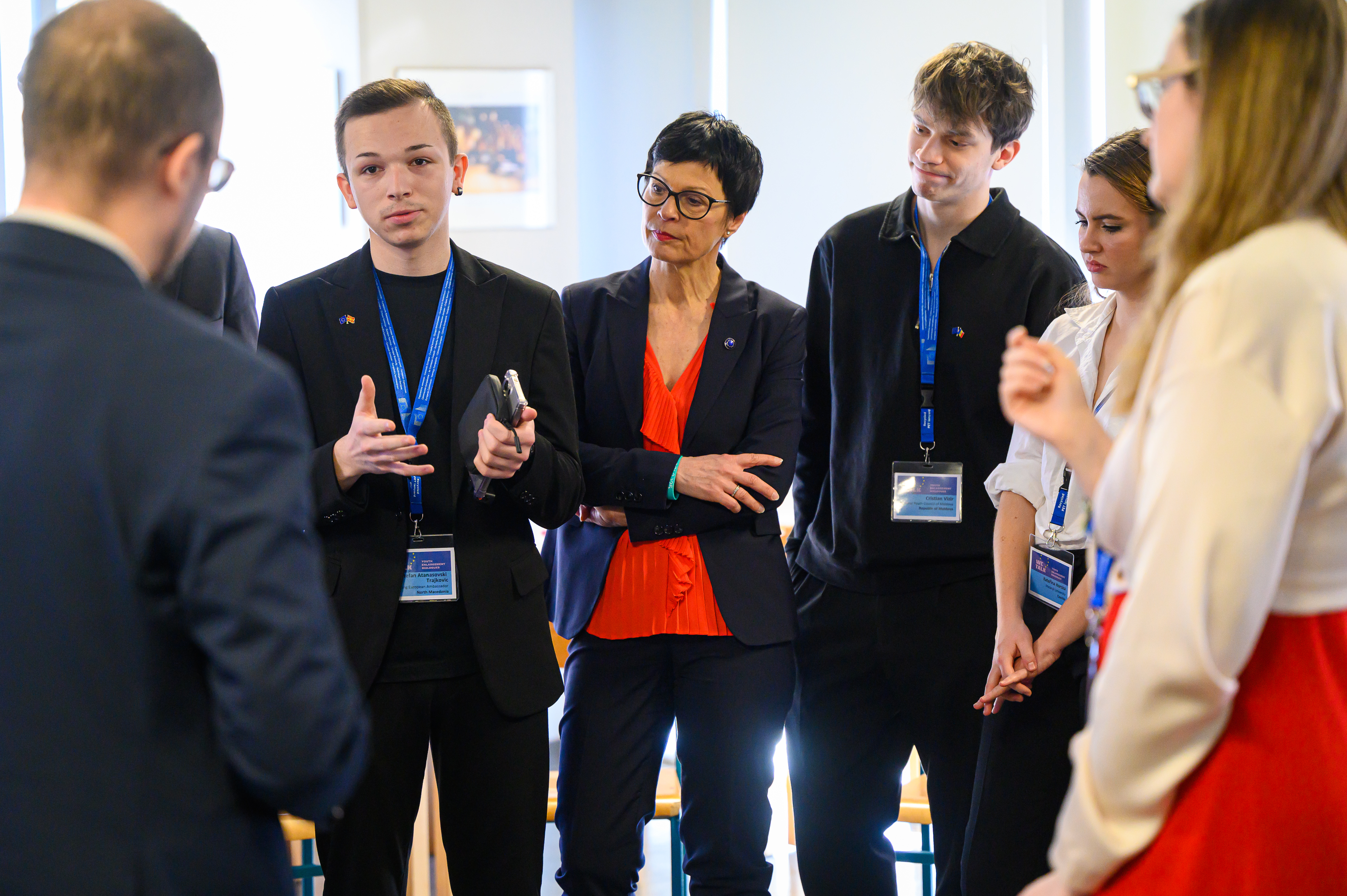 A young participant discusses in a small group