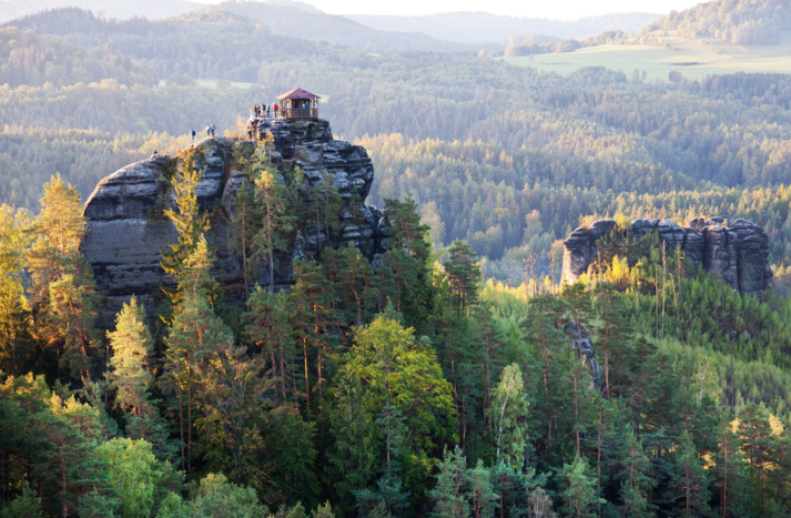 Aerial view from the Jetřichovice trail, centre-left, some people can be seen looking at the view around them. 