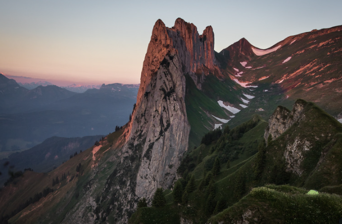 Mountain view on Saxer Lücke, with a small tent on the right side of the photo, where hikers spend the night to watch the view. 