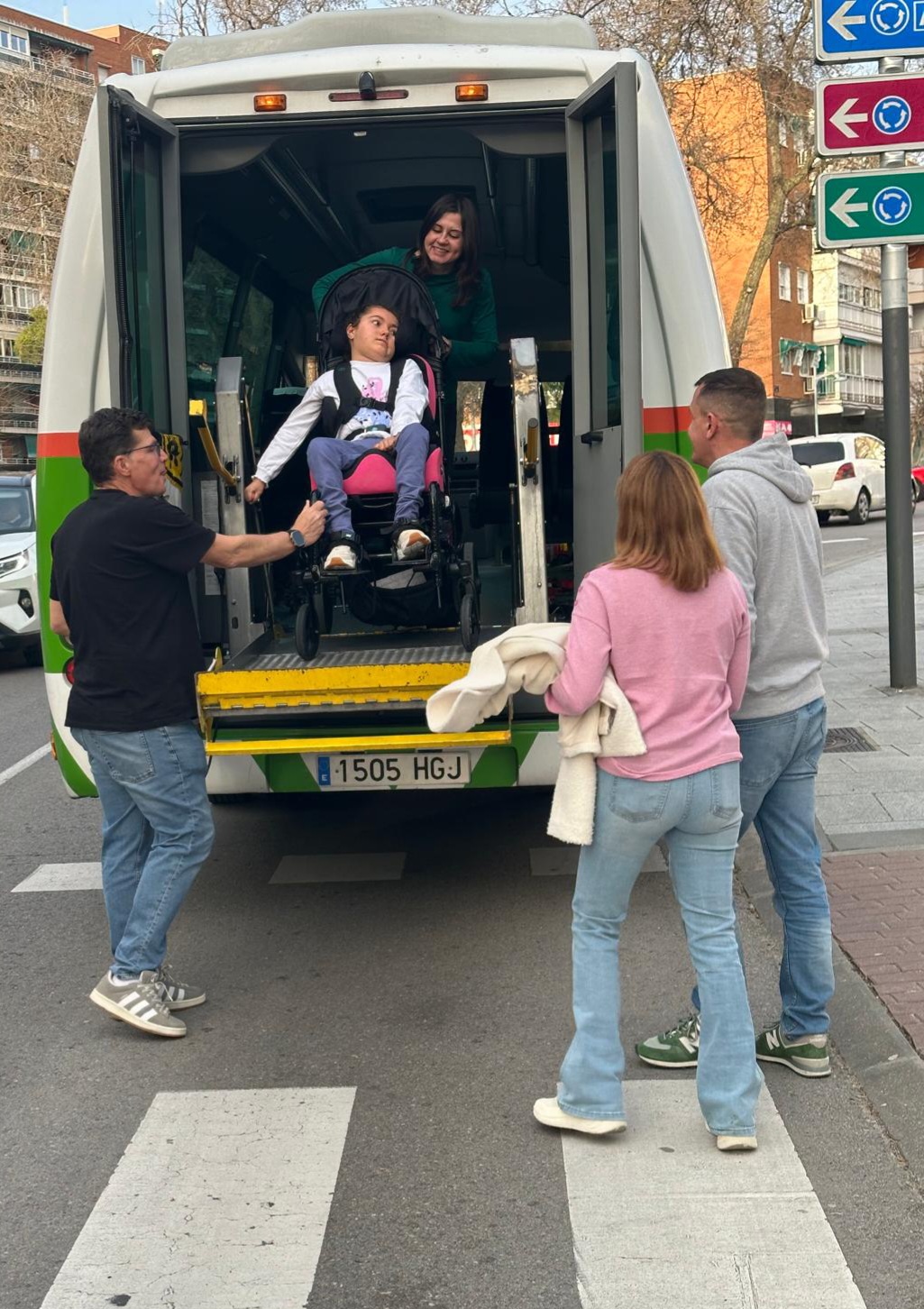 Irene gets out of the minibus with her parents on the right, Abi in the vehicle and Edu on the left.