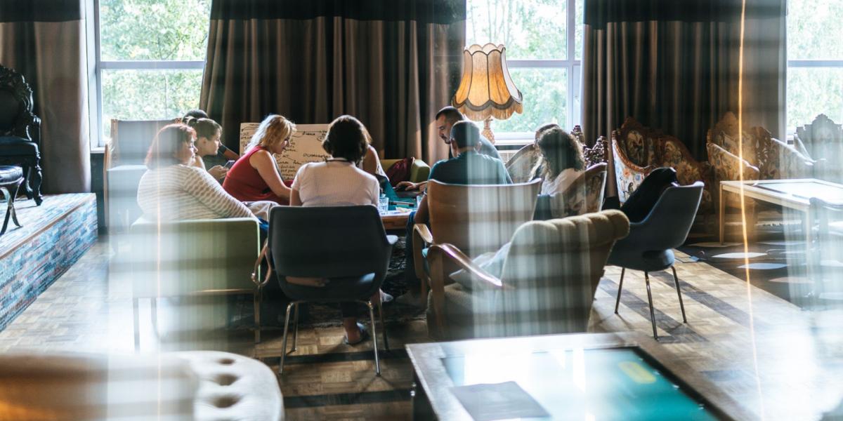 Young people gathered in a living room