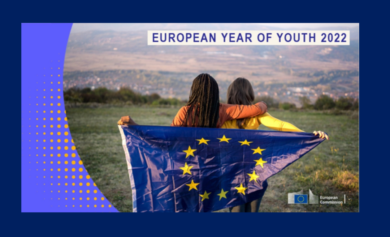 Two girls holding the European flag for the European Year of Youth 2022