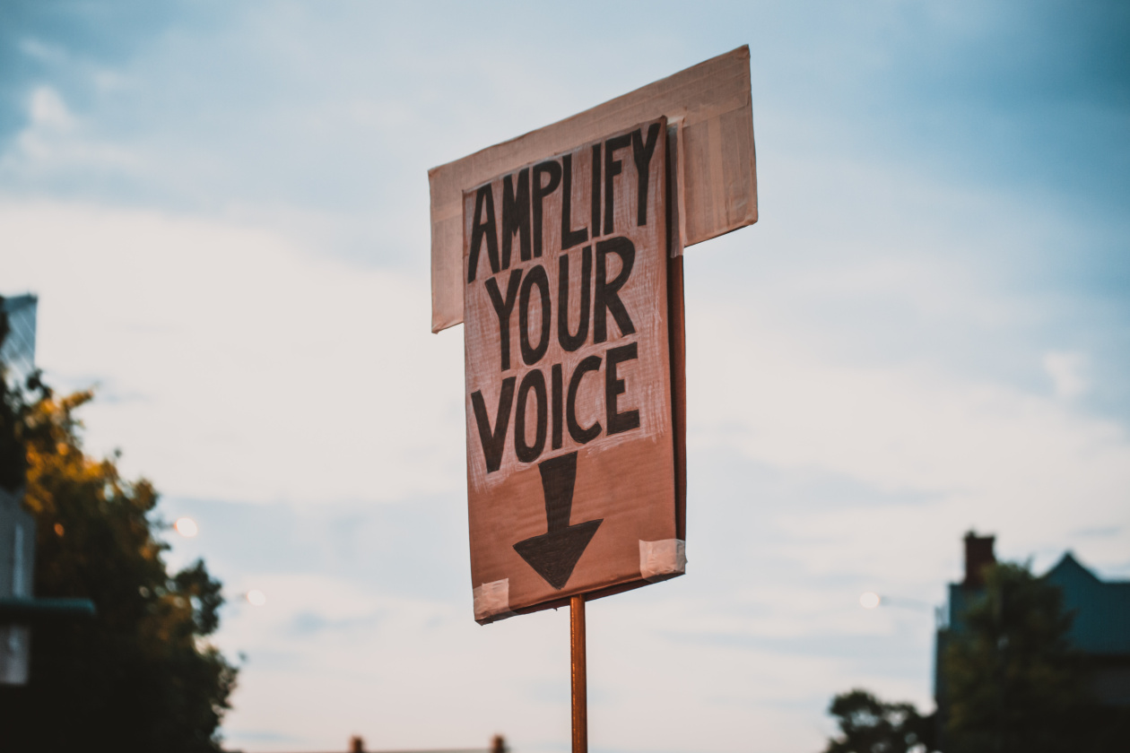 A demo card mentioning the words "Amplify your voice"