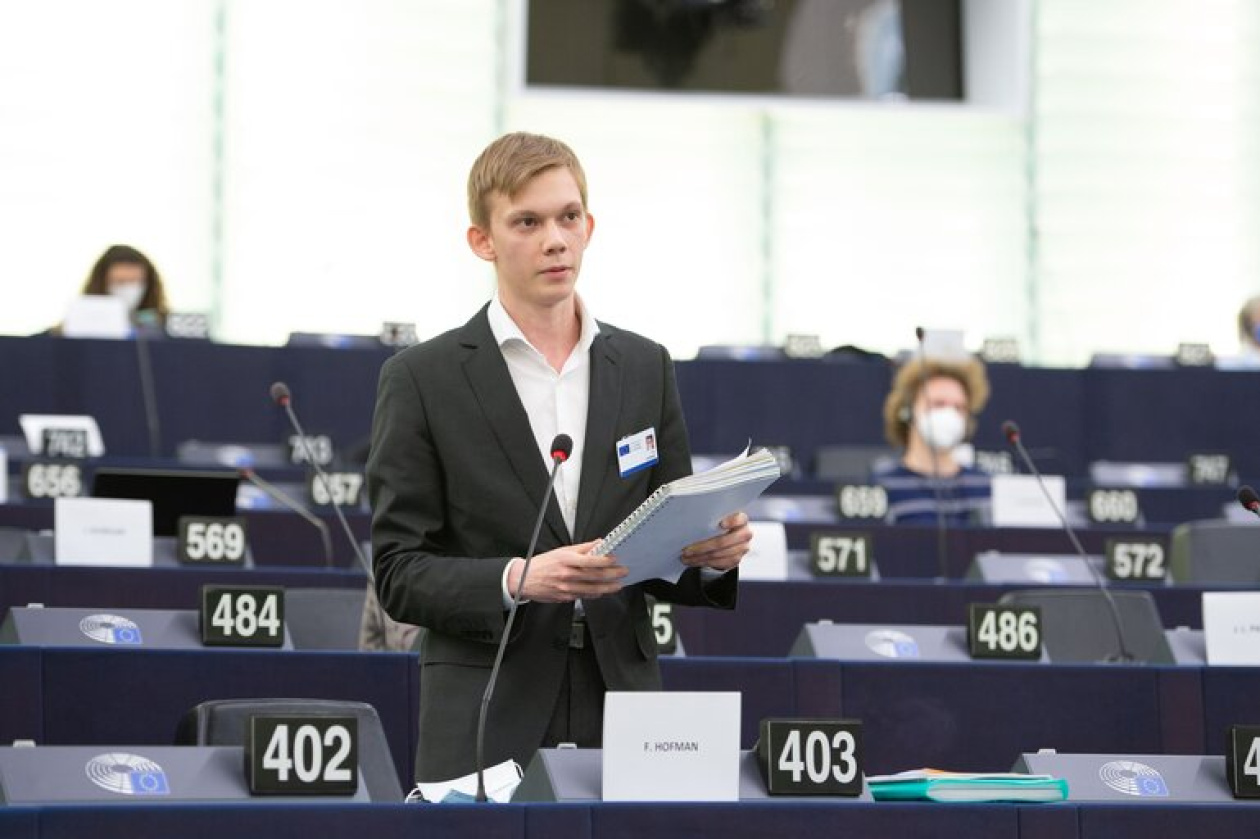 A man speaking at the plenary