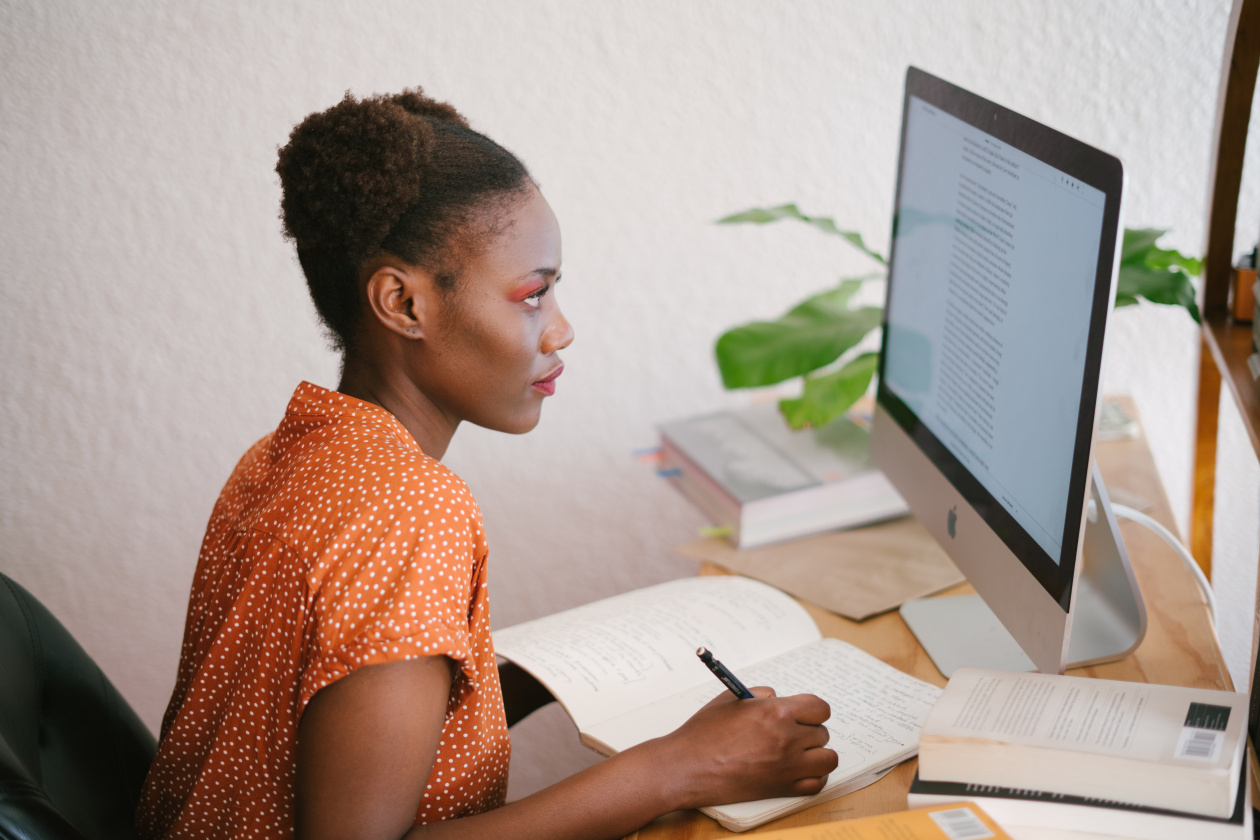Young girl studying in front of a computer