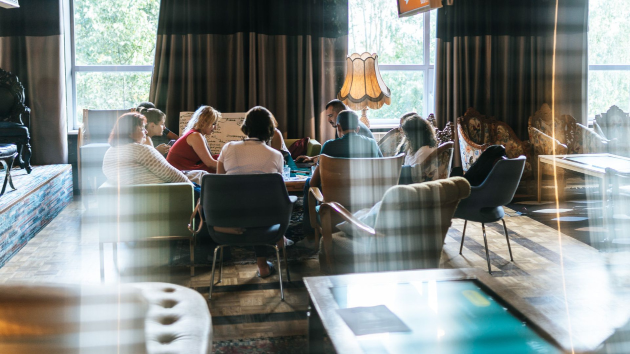 Young people gathered in a living room
