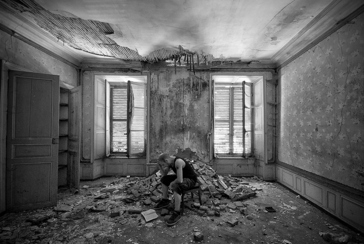 Room inside a ruined house, photo in black and white