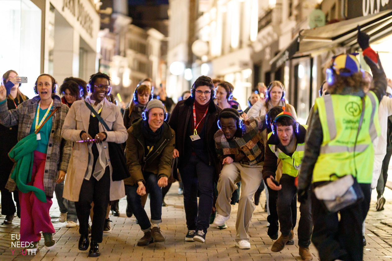 A group of young people dancing outside