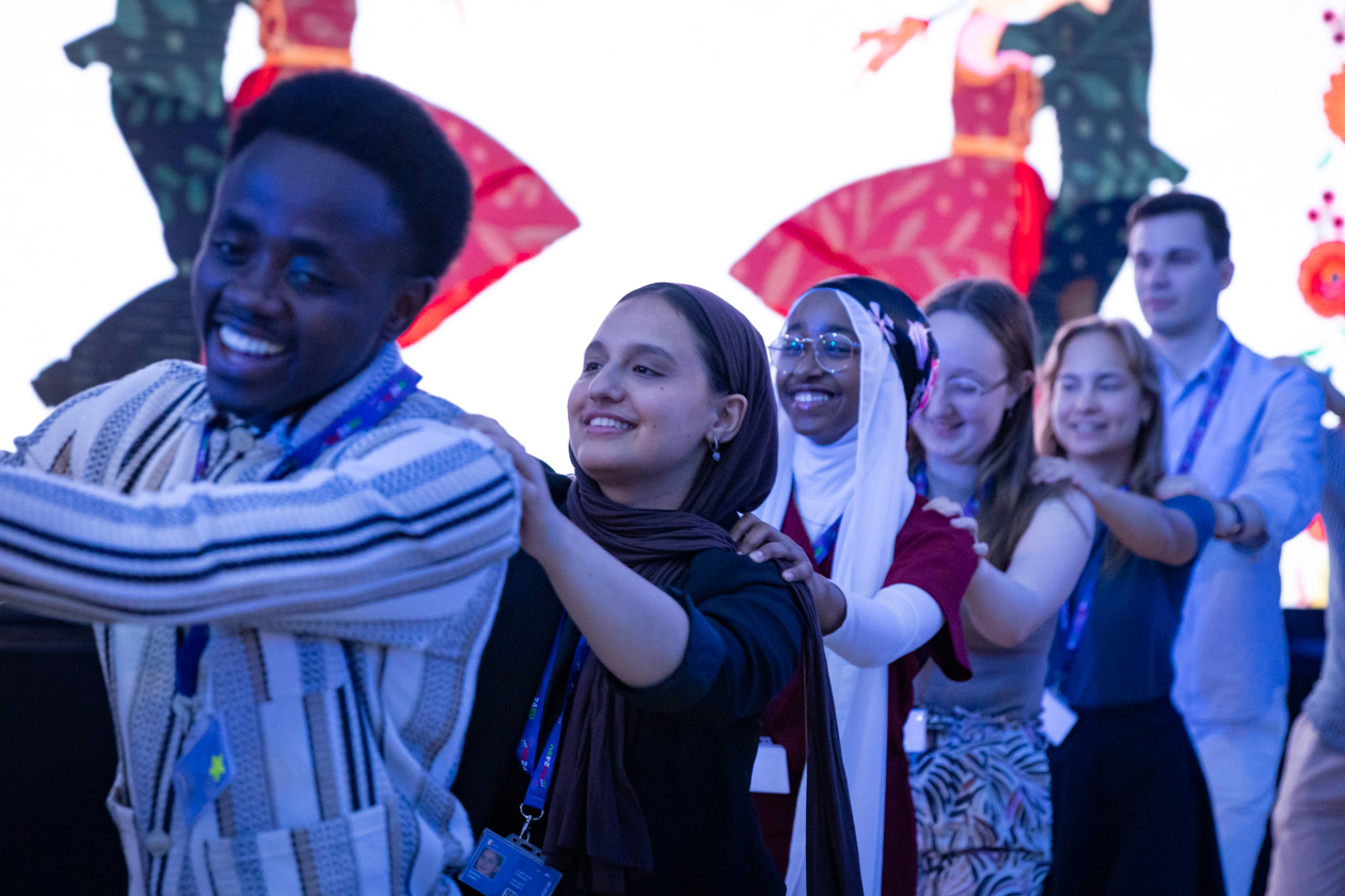 Different people dancing in a line