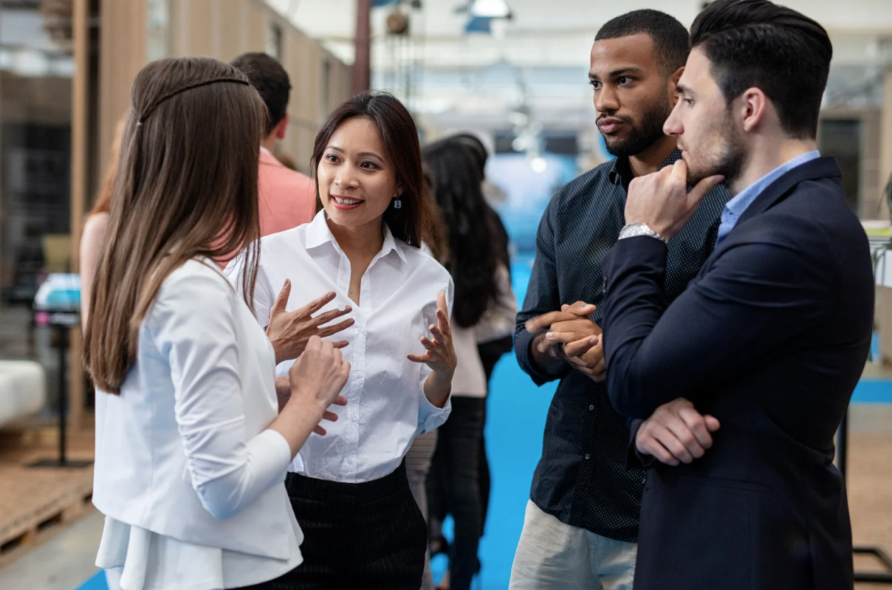 A group of young people discussing with each other