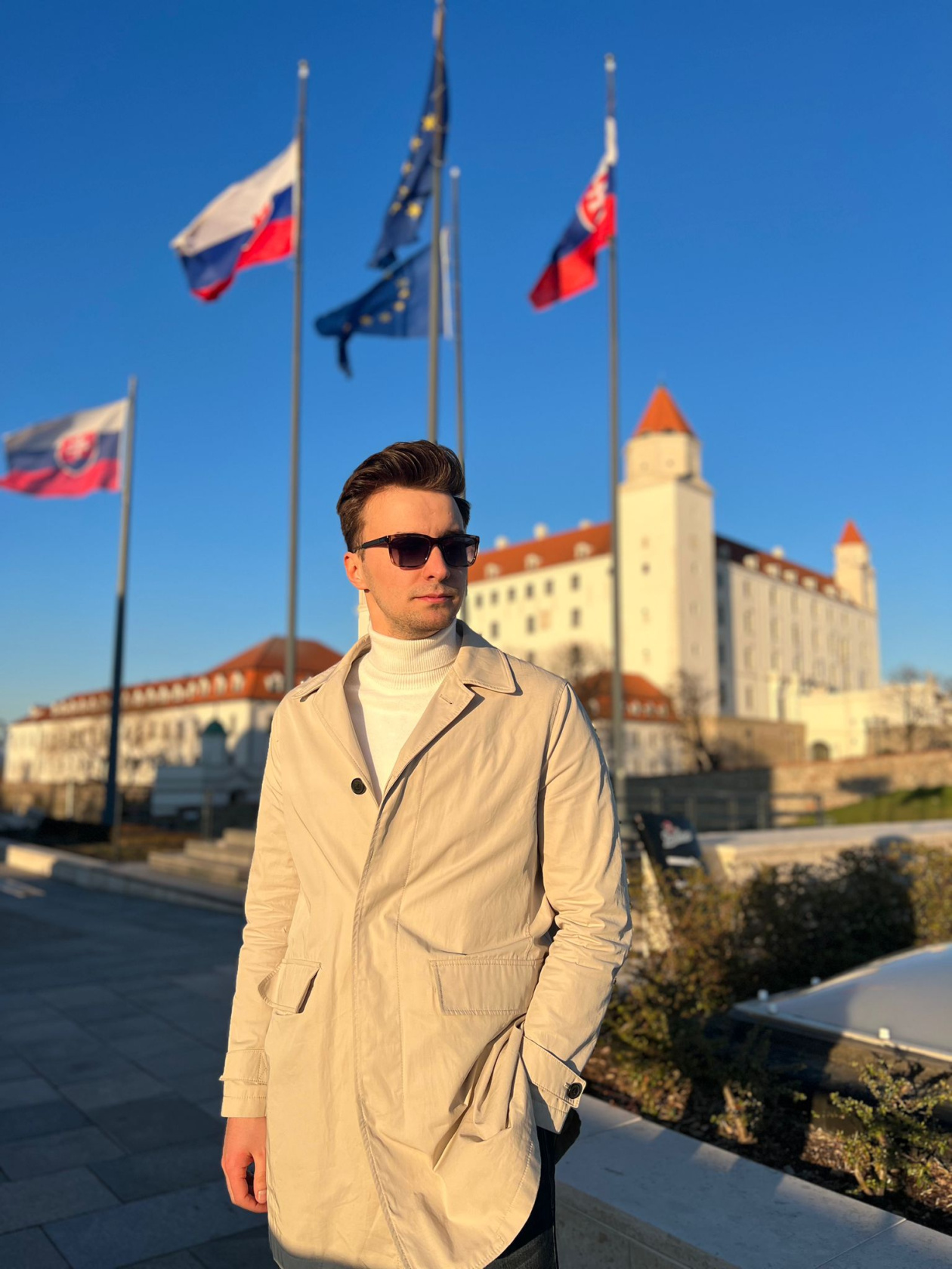 An image of Daniil with a pair of sunglasses, not looking directly at the camera