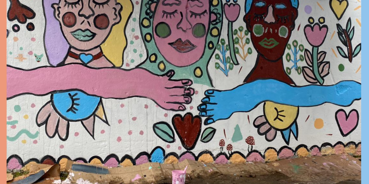 A mural repainted with colourful faces - ©DrONe NGO, Branimira Penić
