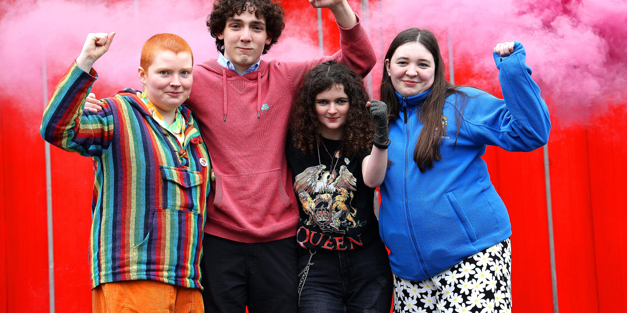 A group of four young people engaged in social rights - credit: Julian Behal
