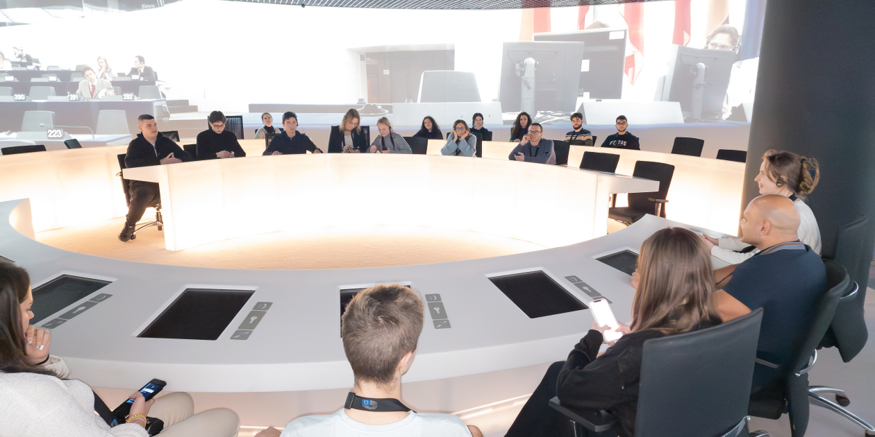 Young people sit on a circle during a meeting