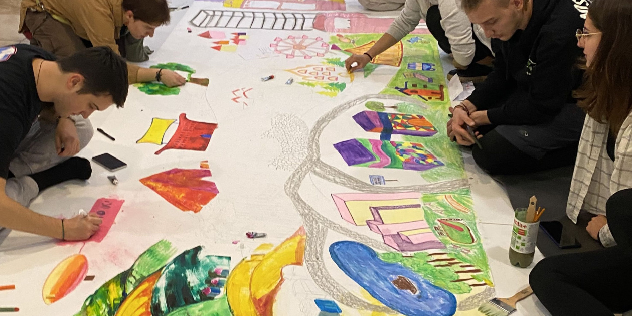 Artists and youth workers creating a mural - Credit: Péter Szlovik