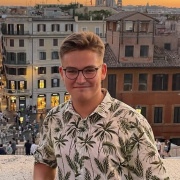 Young boy with city view behind him