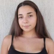 a young girl smiling