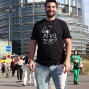 a young man in front of the European parliament