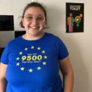 Portrait picture of Victoria, young girl in blue shirt with glasses