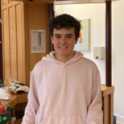 Portrait of Oskar, German boy, in pink sweater