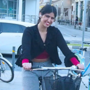 Andria Ioannou posing for the photo at Molos bike lane during Running-Fluent Initiative’s Networking sessions after a multicultural and intercultural full-moon cycling event.