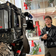 volunteer standing in front of a camera