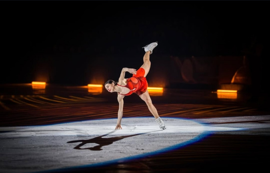 Female in red dress ice-skating
