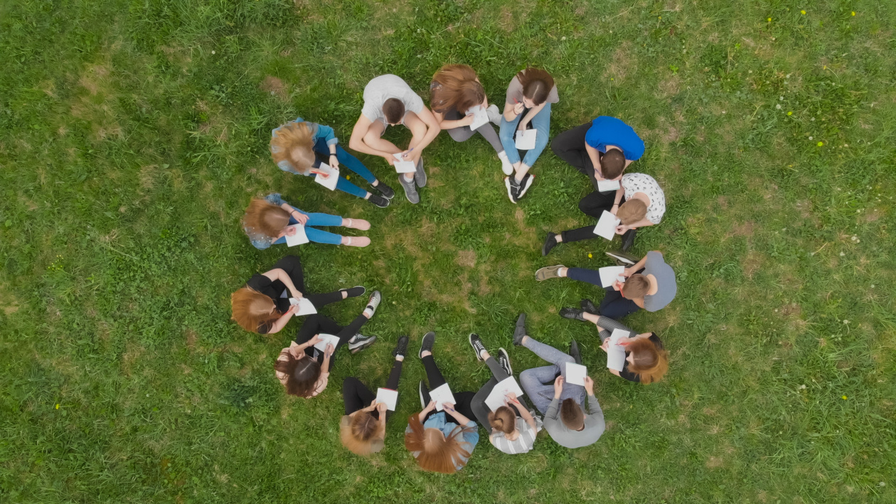 Young people sitting in a circle